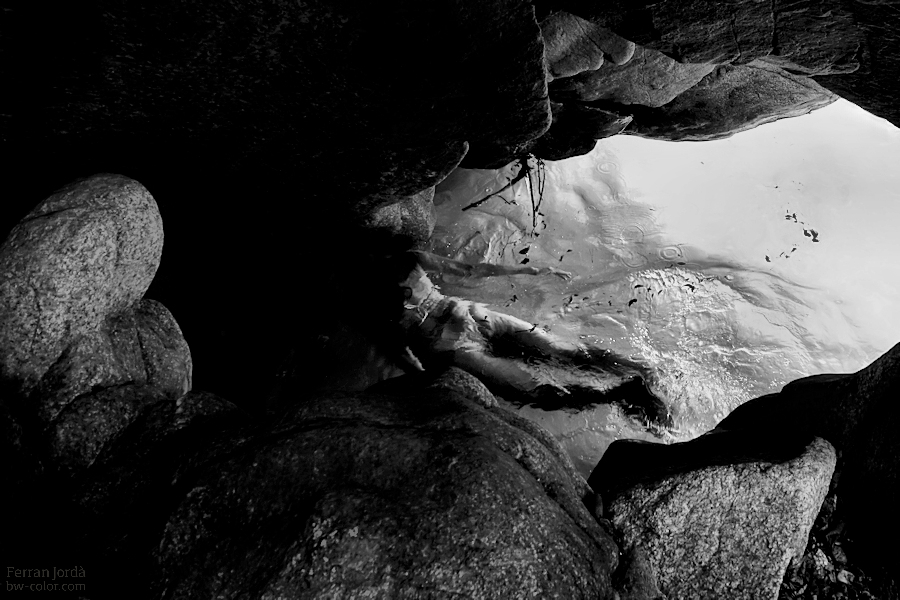 something underwater, under rocks...